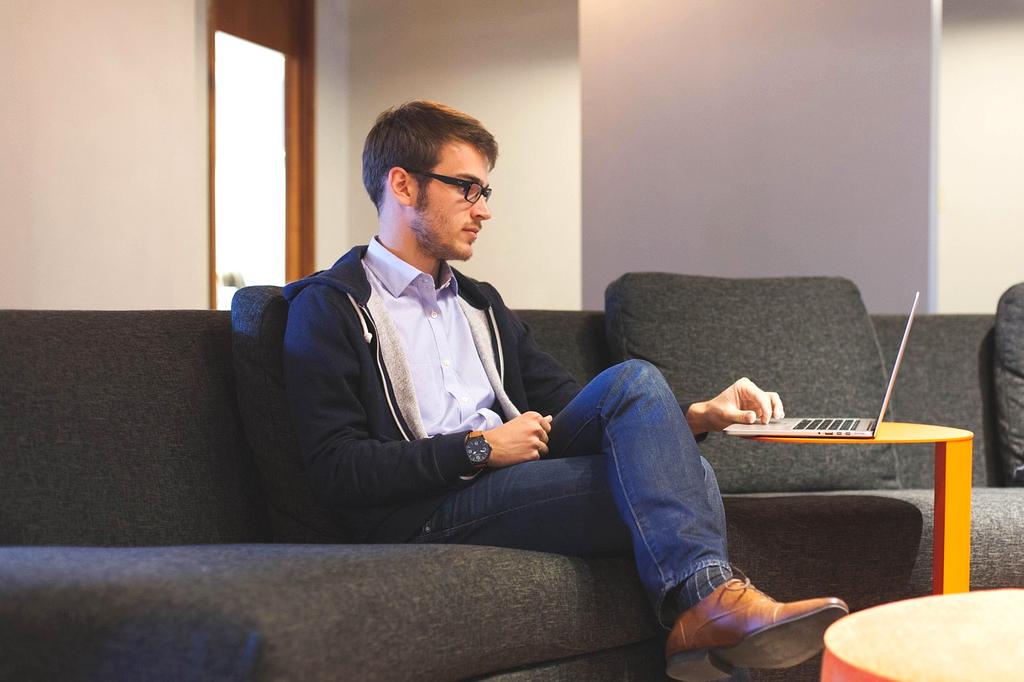 Business owner analyzing charts on computer screen